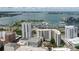 Stunning aerial view of the waterfront property featuring a marina, condos, and breathtaking ocean views at 1255 N Gulfstream Ave # 1104, Sarasota, FL 34236