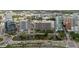 This aerial view showcases the city's architecture, water features, and verdant landscape on a bright day at 1255 N Gulfstream Ave # 1104, Sarasota, FL 34236