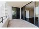 Open balcony showcasing sliding glass doors leading into the unit and building exterior at 1255 N Gulfstream Ave # 1104, Sarasota, FL 34236