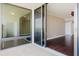 Patio sliding glass doors open to an open floor plan at 1255 N Gulfstream Ave # 1104, Sarasota, FL 34236