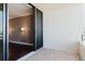 View from balcony into condo showing bright room with beautiful dark wood floors and sconce lighting at 1255 N Gulfstream Ave # 1104, Sarasota, FL 34236