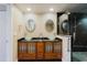 Modern bathroom featuring a double vanity with vessel sinks and a glass-enclosed shower at 1255 N Gulfstream Ave # 1104, Sarasota, FL 34236