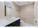 Clean bathroom features dark vanity with white countertop and tile flooring at 1255 N Gulfstream Ave # 1104, Sarasota, FL 34236
