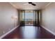 Bright bedroom with beautiful dark wood floors and a sliding glass door to a balcony at 1255 N Gulfstream Ave # 1104, Sarasota, FL 34236