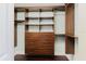 Walk-in closet features custom shelving and drawers for maximum storage at 1255 N Gulfstream Ave # 1104, Sarasota, FL 34236