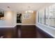 Bright dining room featuring hardwood floors, large windows, and a modern light fixture at 1255 N Gulfstream Ave # 1104, Sarasota, FL 34236