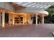 Elegant building entrance with covered walkway and well-maintained landscaping at 1255 N Gulfstream Ave # 1104, Sarasota, FL 34236