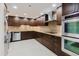 Modern kitchen featuring stainless steel appliances, sleek cabinets and granite counters at 1255 N Gulfstream Ave # 1104, Sarasota, FL 34236