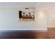 View of the kitchen through a pass-through, showcasing granite counters and dark wood cabinets at 1255 N Gulfstream Ave # 1104, Sarasota, FL 34236
