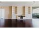Bright open room with hardwood floors and built-in shelving, perfect for storage at 1255 N Gulfstream Ave # 1104, Sarasota, FL 34236
