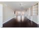Expansive living room showcasing hardwood floors, built-in shelves and cabinets, and modern ceiling fans at 1255 N Gulfstream Ave # 1104, Sarasota, FL 34236