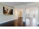 Bright and open living area with hardwood floors flowing into kitchen at 1255 N Gulfstream Ave # 1104, Sarasota, FL 34236
