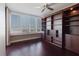 Light-filled living room features large windows and custom built-in shelving at 1255 N Gulfstream Ave # 1104, Sarasota, FL 34236
