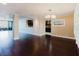 Bright living room featuring hardwood floors, and views of the adjacent kitchen and ceiling fans at 1255 N Gulfstream Ave # 1104, Sarasota, FL 34236