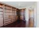 Bright living room features custom built-in shelving and dark wood flooring at 1255 N Gulfstream Ave # 1104, Sarasota, FL 34236