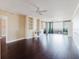 Spacious living room boasts hardwood floors, built-in shelving and access to balcony at 1255 N Gulfstream Ave # 1104, Sarasota, FL 34236