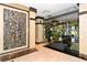 Refined lobby showcases stunning artwork, comfortable seating, and views to the outdoors at 1255 N Gulfstream Ave # 1104, Sarasota, FL 34236