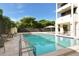 Outdoor pool with poolside seating offers a refreshing escape and a place to relax at 1255 N Gulfstream Ave # 1104, Sarasota, FL 34236
