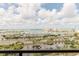 Breathtaking waterfront view showcasing lush greenery, water and multiple boats on a clear sunny day at 1255 N Gulfstream Ave # 1104, Sarasota, FL 34236