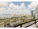 Expansive waterfront view captures skyline, boat docks, and a tranquil pond with lush greenery at 1255 N Gulfstream Ave # 1104, Sarasota, FL 34236