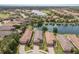 Aerial view of homes surrounding a scenic lake community at 13338 Torresina Ter, Lakewood Ranch, FL 34211