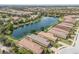 Residential homes bordering a tranquil lake in a suburban community at 13338 Torresina Ter, Lakewood Ranch, FL 34211