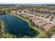 Scenic aerial view of a residential area around a beautiful lake at 13338 Torresina Ter, Lakewood Ranch, FL 34211