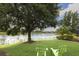 Green lawn with lake views and comfortable seating at 13338 Torresina Ter, Lakewood Ranch, FL 34211
