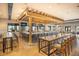 Spacious bar area with modern countertops, plenty of seating, and several televisions at 13338 Torresina Ter, Lakewood Ranch, FL 34211