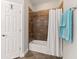 Bathroom with tub and tile surround featuring a shower head at 13338 Torresina Ter, Lakewood Ranch, FL 34211