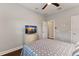 Bedroom with a television on a decorative dresser and ceiling fan for added comfort at 13338 Torresina Ter, Lakewood Ranch, FL 34211