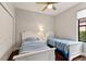 Bedroom with twin beds, carpet flooring and ample closet space at 13338 Torresina Ter, Lakewood Ranch, FL 34211
