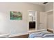 Bright bedroom with ensuite bathroom, framed by the charming manatee wall art at 13338 Torresina Ter, Lakewood Ranch, FL 34211