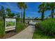 View of bocce ball courts with lush landscaping and signage at 13338 Torresina Ter, Lakewood Ranch, FL 34211