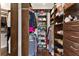 Spacious walk in closet with extensive storage and organization solutions at 13338 Torresina Ter, Lakewood Ranch, FL 34211