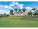 Welcoming entrance sign to Esplanade Golf & Country Club with lush landscaping and palm trees at 13338 Torresina Ter, Lakewood Ranch, FL 34211