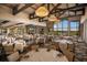 Large event space with round tables, upscale decor, great lighting, and beautiful lake views at 13338 Torresina Ter, Lakewood Ranch, FL 34211