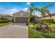 Home featuring a well-maintained lawn at 13338 Torresina Ter, Lakewood Ranch, FL 34211