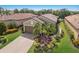 Beautiful home with a well-manicured lawn and lush landscaping at 13338 Torresina Ter, Lakewood Ranch, FL 34211