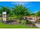 Outdoor fire pit area with stone accents and comfortable seating, perfect for community gatherings at 13338 Torresina Ter, Lakewood Ranch, FL 34211
