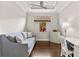 Well-lit office with stylish decor, a comfortable couch, and a work desk at 13338 Torresina Ter, Lakewood Ranch, FL 34211