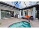 Inviting screened lanai with a pool, summer kitchen, and comfortable seating area at 13338 Torresina Ter, Lakewood Ranch, FL 34211
