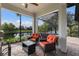 Picturesque screened lanai offering beautiful water views with comfortable seating area at 13338 Torresina Ter, Lakewood Ranch, FL 34211