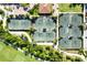 Aerial view of active tennis courts with lush landscaping, parking, and green space at 13338 Torresina Ter, Lakewood Ranch, FL 34211