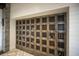 Wine room featuring wooden storage lockers and a ceramic tile floor at 13338 Torresina Ter, Lakewood Ranch, FL 34211