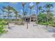 Charming Bahama Bar surrounded by lush palm trees, perfect for enjoying refreshments at 13609 Messina Loop # 104, Bradenton, FL 34211
