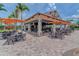 Outdoor seating at Bahama Bar with umbrellas, providing a relaxing atmosphere at 13609 Messina Loop # 104, Bradenton, FL 34211