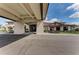 Elegant clubhouse entrance featuring a porte-cochère, stone accents, and manicured landscaping at 13609 Messina Loop # 104, Bradenton, FL 34211