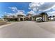 Grand entrance to the community clubhouse, showcasing its impressive architecture at 13609 Messina Loop # 104, Bradenton, FL 34211