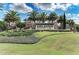 Elegant entrance sign for Esplanade Golf & Country Club, showcasing lush landscaping at 13609 Messina Loop # 104, Bradenton, FL 34211